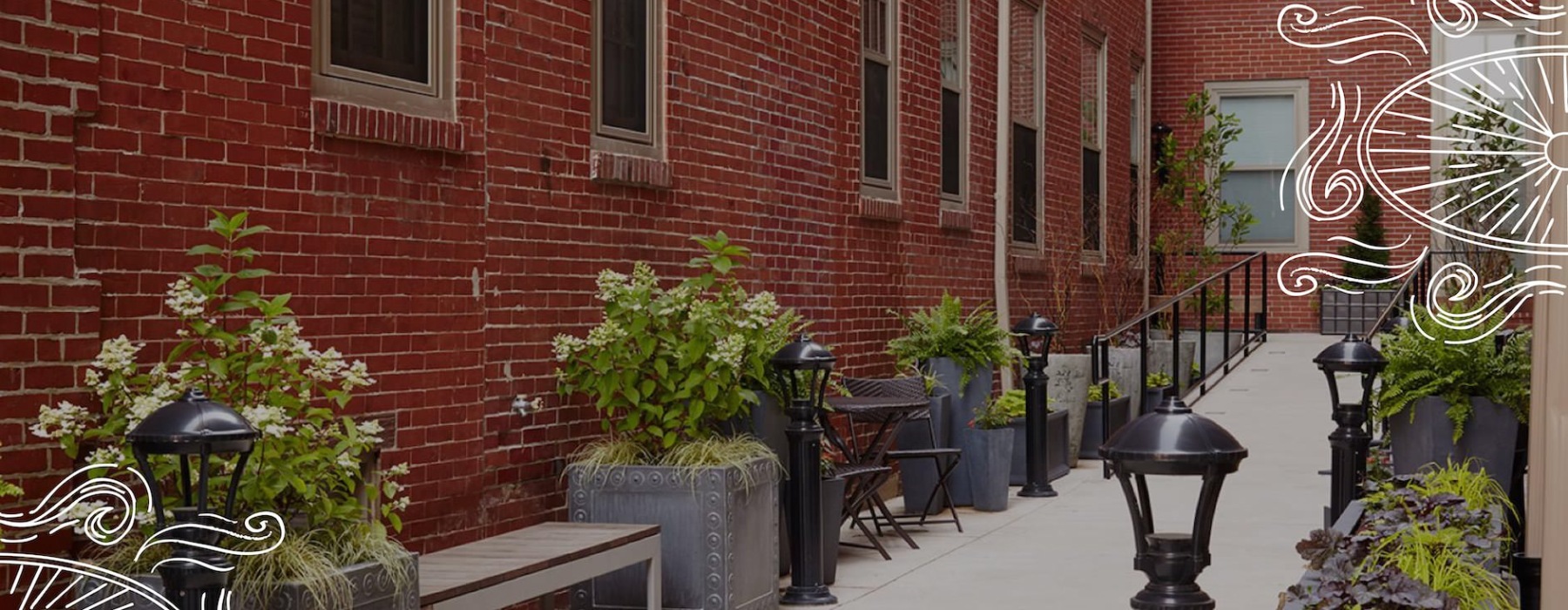 walkway with bench and planters