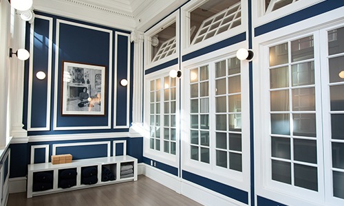 blue painted room with windows